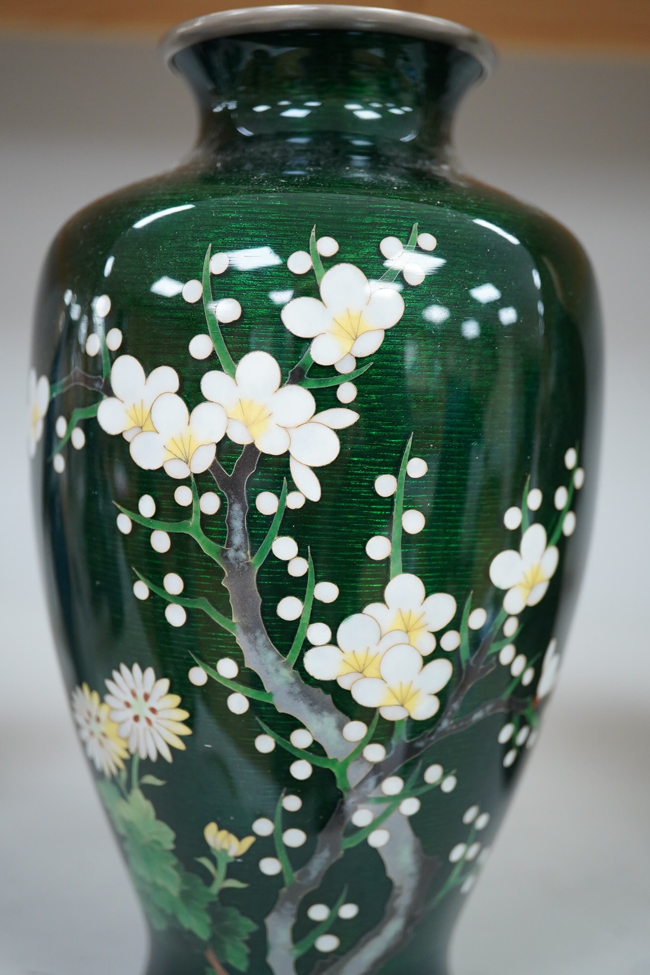 A mid 20th century Japanese green prunus silver wire cloisonné enamel vase, by Ando, 19cm high., Condition - good